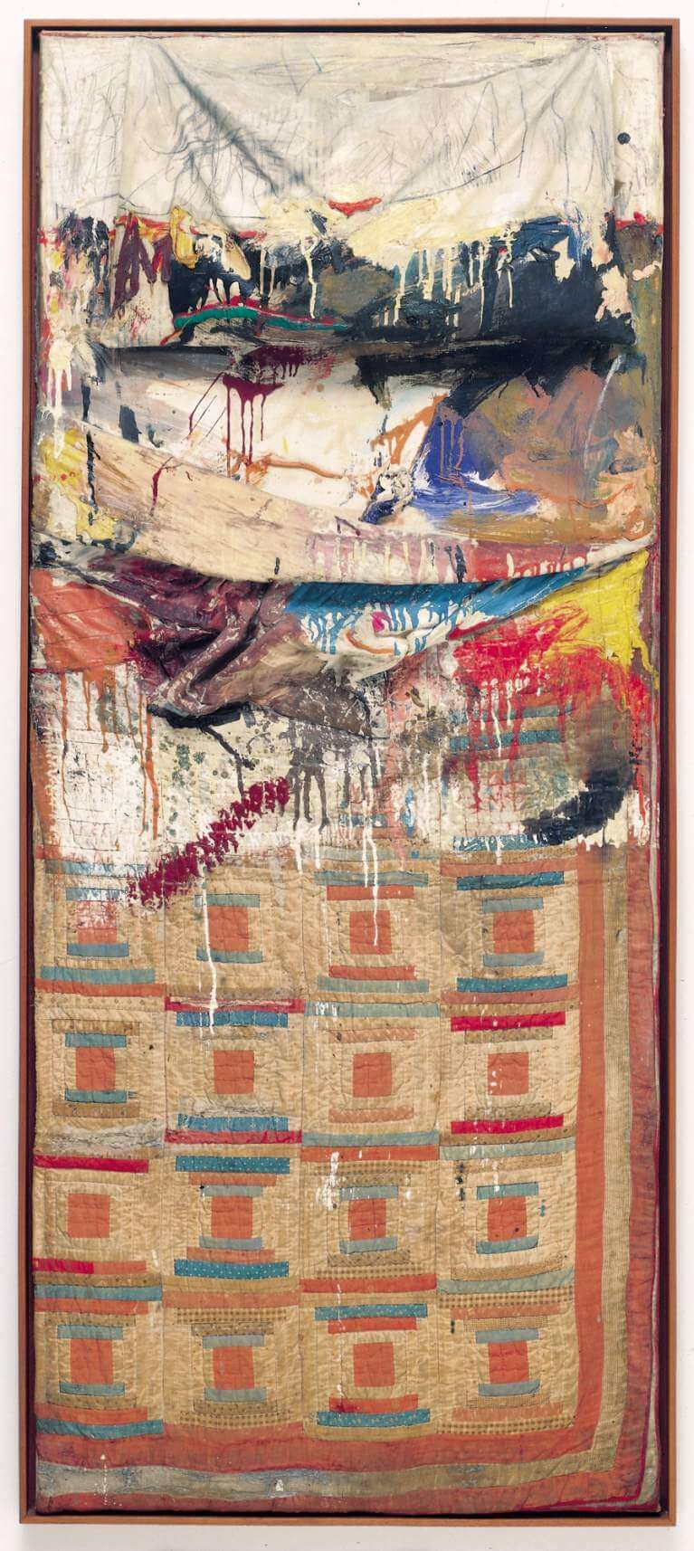 A mixed-media artwork featuring an abstract painted upper half with splashes and drips, and a patchwork quilt with geometric patterns on the lower half, all enclosed in a wooden frame.