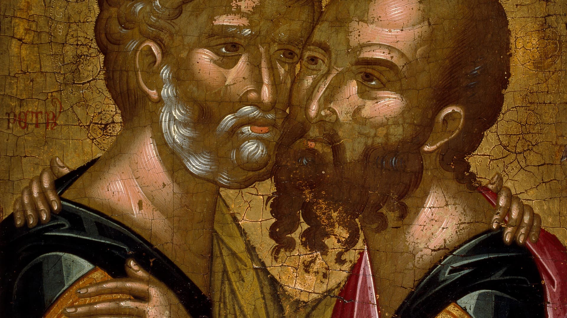 Two men with beards, dressed in robes, embrace closely and touch cheeks. The painting is old, with visible cracks and a warm color palette.